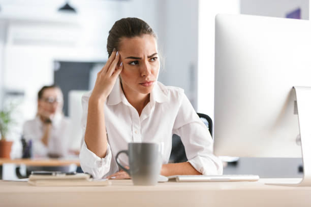 istock Business woman sitting in office working with computer. 1329491867