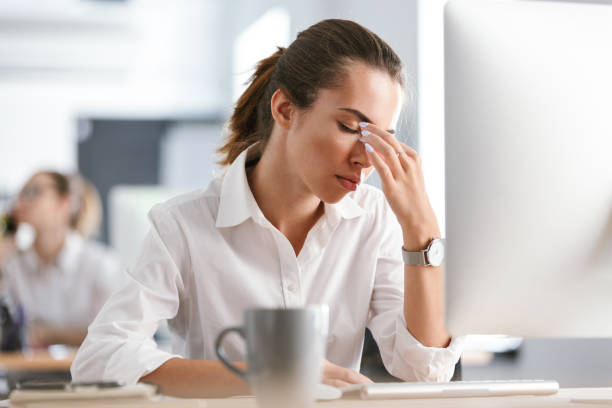 istock Confused bored young business woman work in the office with computer. 1329491905