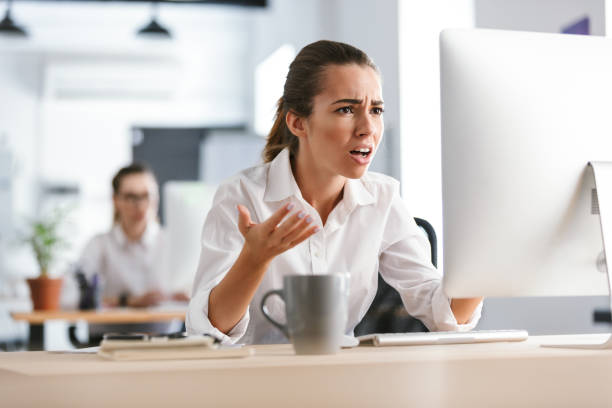 istock Confused young business woman work in the office with computer. 1329492000