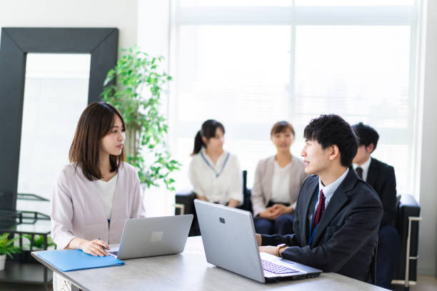 istock Business persons having a meeting 1329494381