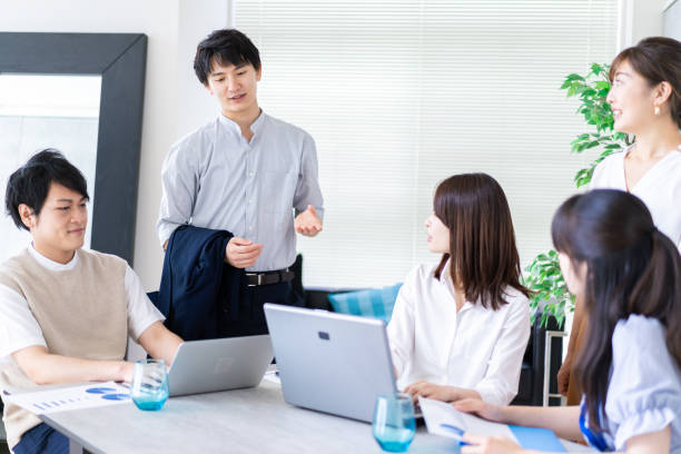 istock Business persons having a meeting 1329494402