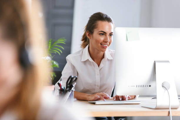 istock Smiling young woman dressed in shirt 1329495745