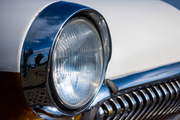 istock Chrome plated front lamp of a restored classic car. 1329497011