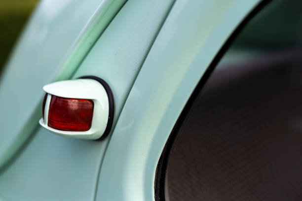 istock Rear lamp of a green restored classic car. 1329497100