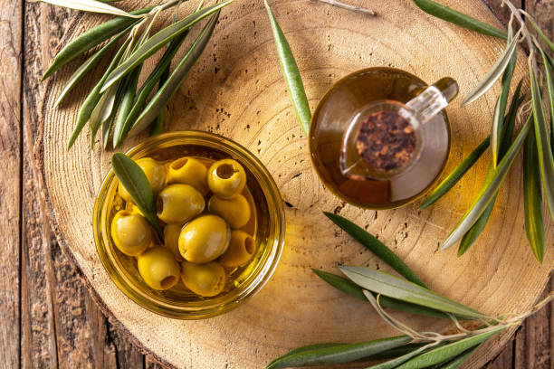 istock Virgin olive with green olives in crystal bowl 1329498486