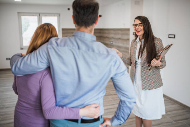 istock Couple and real estate agent 1329499949