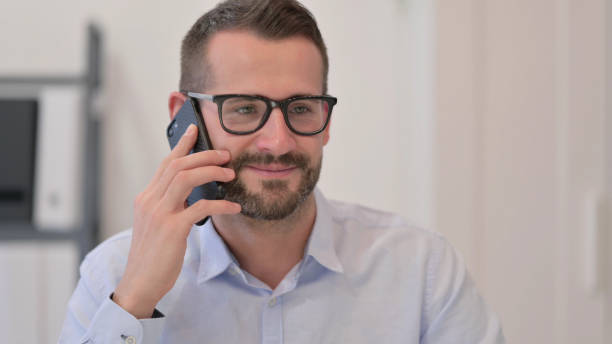 istock Portrait of Middle Aged Man Talking on Smartphone 1329501149