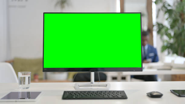 istock Close Up of Desktop with Green Chroma Key Screen 1329501235