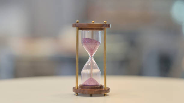 istock Close Up of Hourglass on Table 1329502056