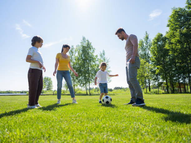 Free Stock Photo of Family playing soccer in sunny park | Download Free ...