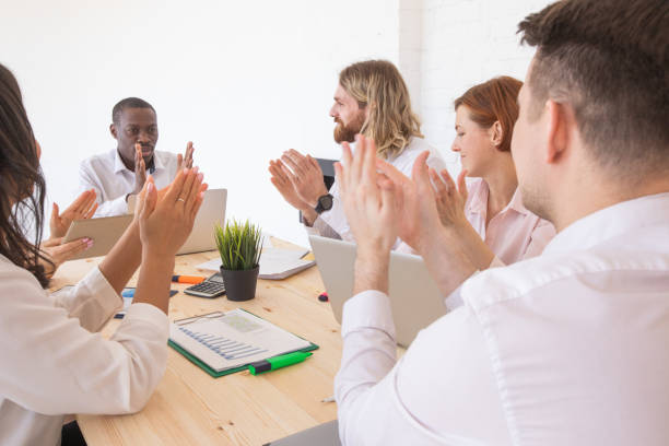 istock Business people applause at meeting 1329502251