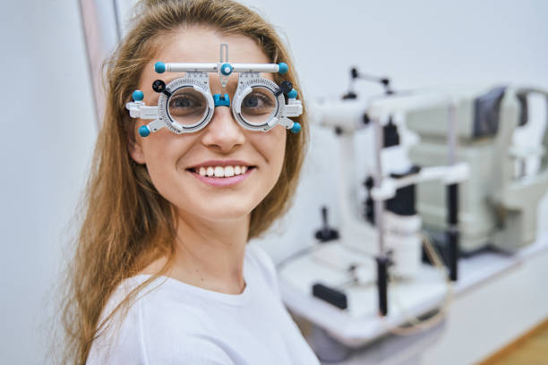 istock Cheerful young woman wearing optical trial lens frame 1329505062