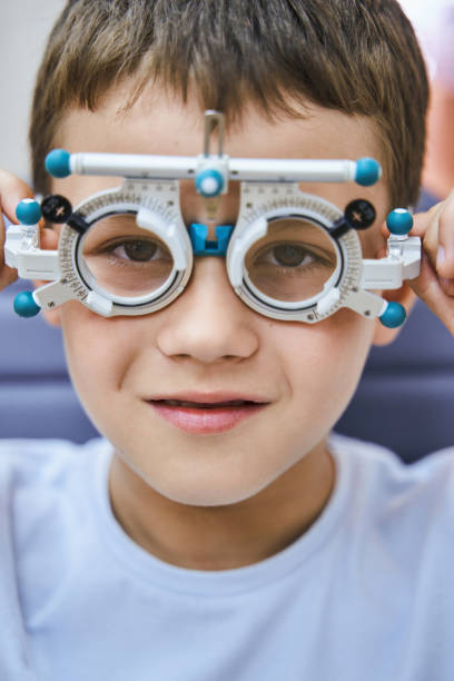 istock Cute little boy wearing optical trial lens frame 1329505064