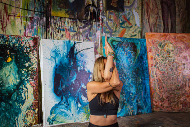 istock Finding serenity in her body, while trying to do lotus flow yoga pose 1329506138