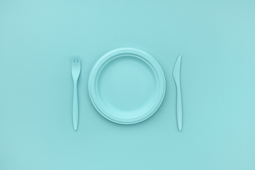 Empty plate and cutlery. Monochrome blue color. Minimalistic concept. Breakfast, lunch, dinner.