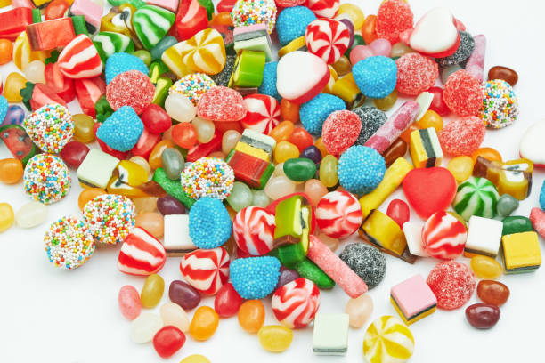 istock Multi-colored gummy candies on a white background. Festive backdrop. 1329506194