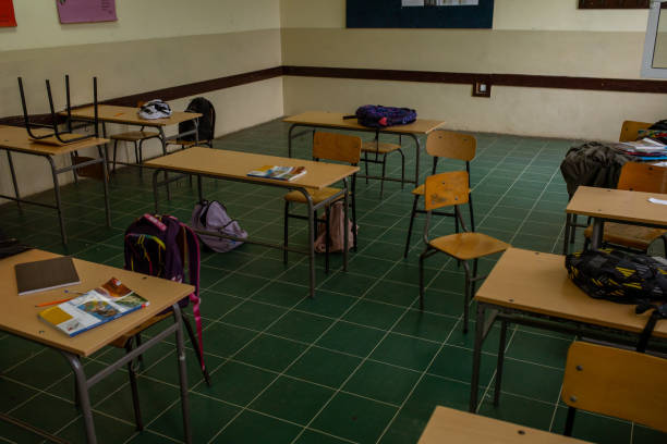 istock School supplies and students backpacks at the classroom 1329506787