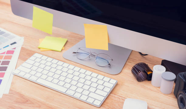 istock Top View of creative table with large desktop computer. working Place for graphic design. 1329507498
