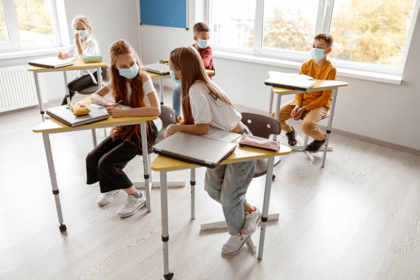 istock School kids with notebooks enjoying of study together 1329507675