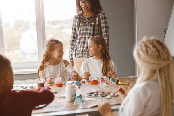 istock Children making art painting using water colors 1329507766