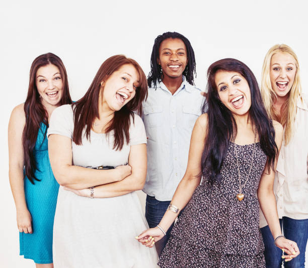 istock Group of several young people laughing and smiling together 1329509209