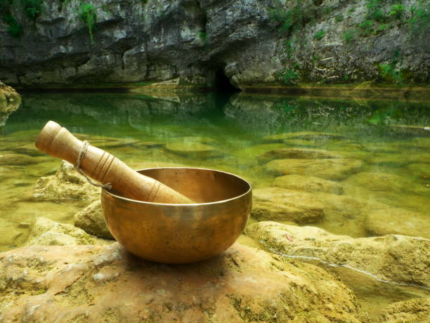 istock Singing bowl placed in the nature with the river in the background 1329510251