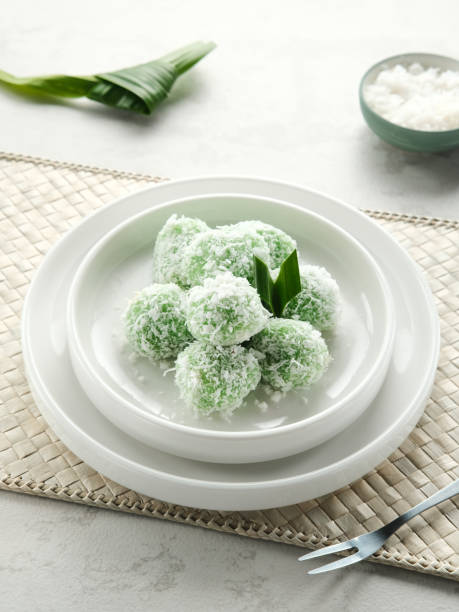 istock Klepon is Indonesian popular traditional snack, made from glutinous rice flour which is formed into small balls and filled with brown sugar. 1329510563