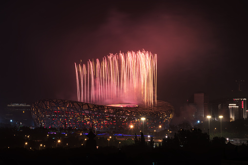 Beijing, China June 22, 2021: Fireworks over the very beautiful lair of the Beijing National Stadium. Beijing Bird's Nest National Stadium is the venue of the 2008 Beijing Olympic Games