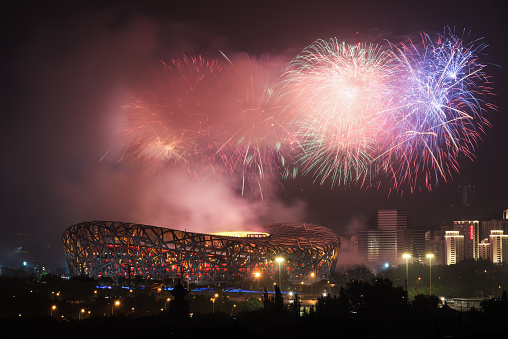 Beijing, China June 22, 2021: Fireworks over the very beautiful lair of the Beijing National Stadium. Beijing Bird's Nest National Stadium is the venue of the 2008 Beijing Olympic Games
