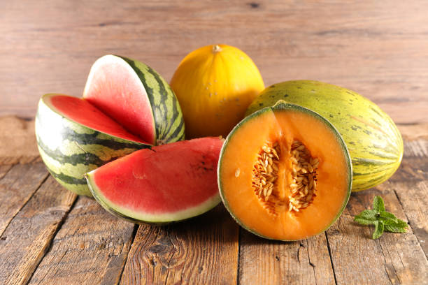 istock watermelon and melon on wood background 1329516237
