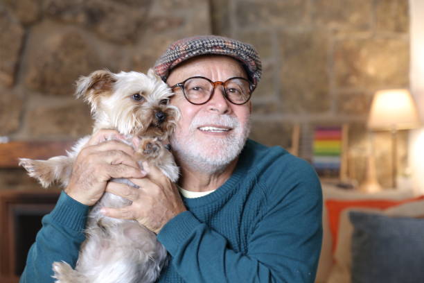 istock Tender senior man holding Yorkshire terrier 1329516307