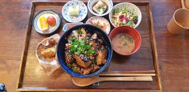 istock rice with eggplant with side dishes on the plate 1329518053