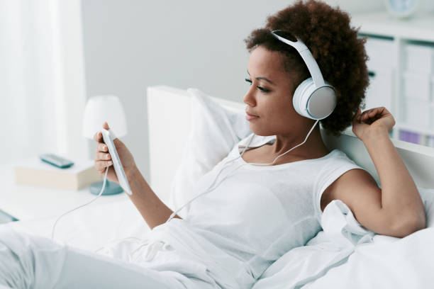 istock Woman relaxing on the bed 1329518662