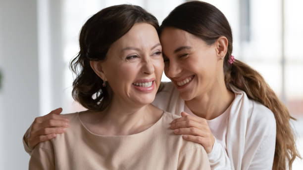 istock Happy loving grownup daughter hug older mom 1329519437
