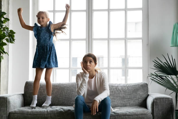istock Unhappy mother tired with loud small daughter 1329519528