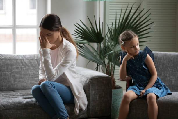 istock Upset mom and small daughter avoid talking after fight 1329519531