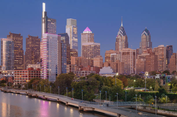 istock Philadelphia Downtown skyline at Night with the Schuylkill river. Beautiful Sunset Light. Schuylkill River Trail in Background. City skyline glows under the beautiful sunset light. Cityscape. PA, USA. 1329519882