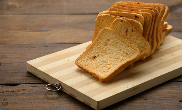 istock sliced white wheat flour bread on a wooden board. Sandwich bread 1329520099