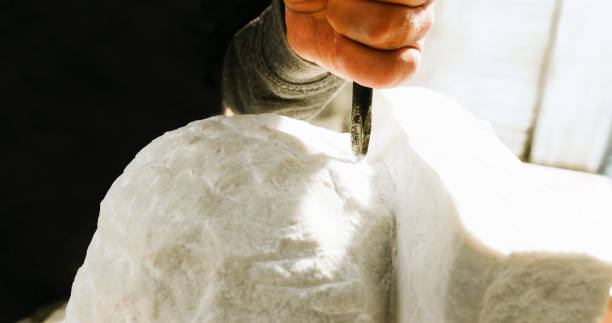 istock Stonemason carving a sculpture in the workshop 1329520225