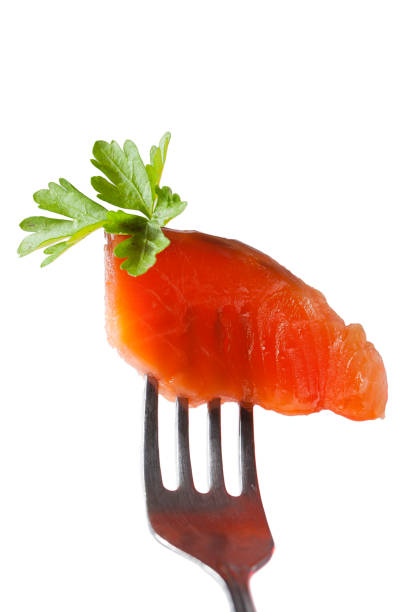 istock One slice of fresh salmon fillet on a fork 1329521155