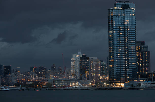 NYC Cityscape with Stormy Cloudy Blue Sky in Background