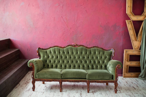istock Vintage sofa in dark loft room 1329522571