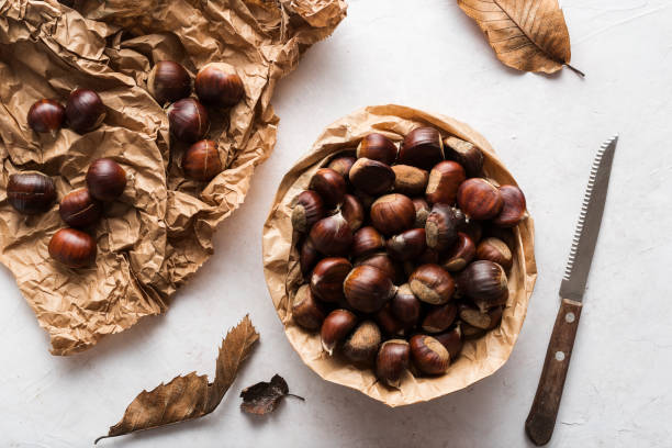 Chestnuts Top view of chestnuts on delicate background chestnut food stock pictures, royalty-free photos & images