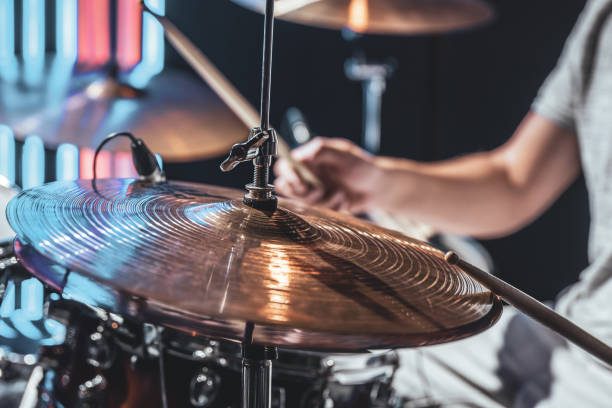 istock A male drummer plays drums with special drum sticks. 1329524336