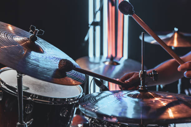 istock A male drummer plays drums with special drum sticks. 1329524338