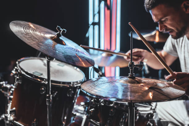 istock A male drummer plays drums with drum sticks. 1329524342