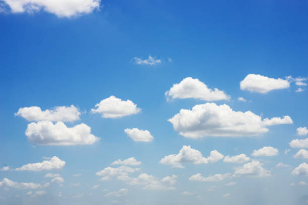 istock beautiful blue sky and white fluffy cloud horizon outdoor for background. 1329524406