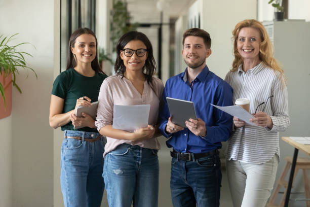 istock Happy multiethnic different aged business team posing in office 1329526386
