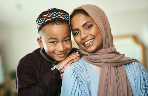 istock Shot a young boy stand with his mother at home 1329527151