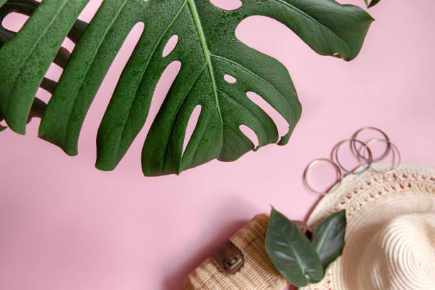 istock Flat lay composition with monstera leaf and summer womens accessories. 1329528848